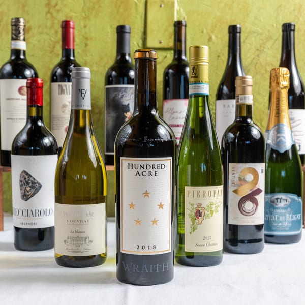 A collection of various red, white, and sparkling wine bottles from Mona Lisa Cucina.